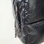 Moncler long puffer jacket close-up of zipper tape with Moncler branding