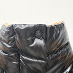 Moncler long puffer jacket chest logo patch on shiny dark quilted fabric