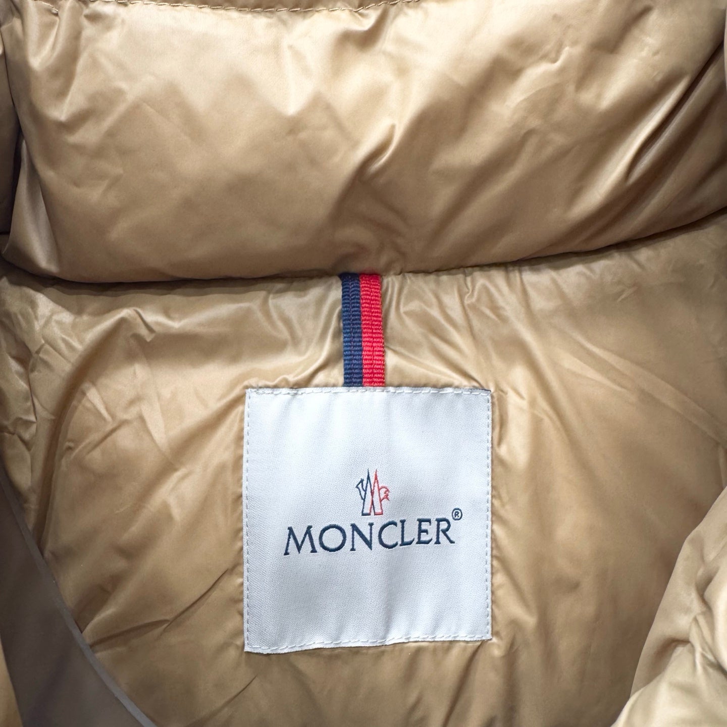 Moncler long jacket, beige padded front with logo patch and trim stripe