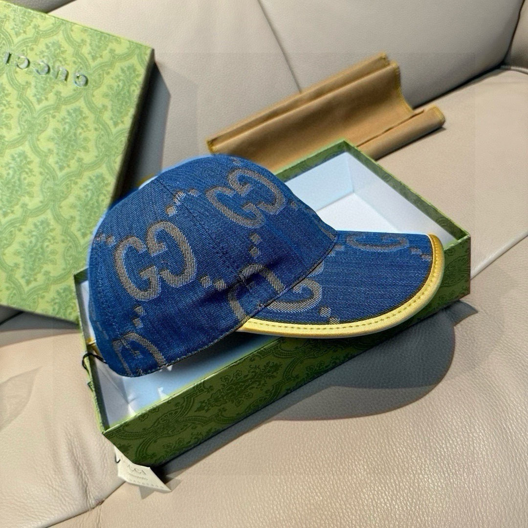 Gucci denim cap in blue with GG pattern and yellow-trimmed curved brim