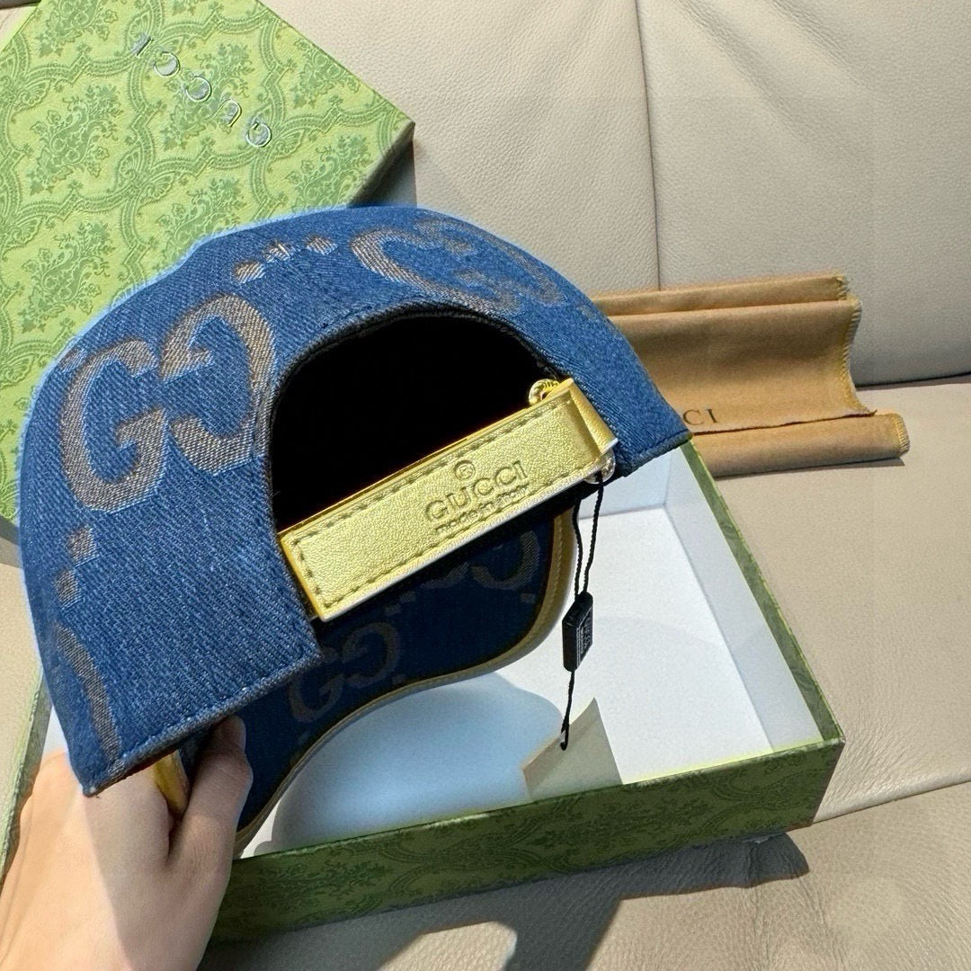 Gucci denim cap in blue with GG pattern, black lining, and gold Gucci label
