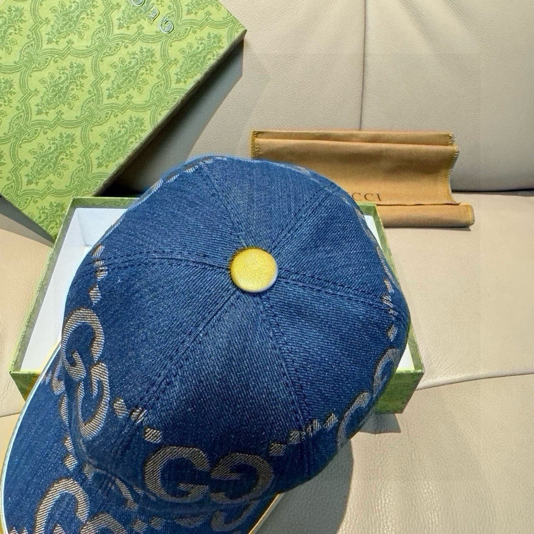 Gucci denim cap in blue with GG pattern and round yellow button on top