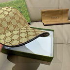 Gucci GG monogram cap with black underside and curved brim