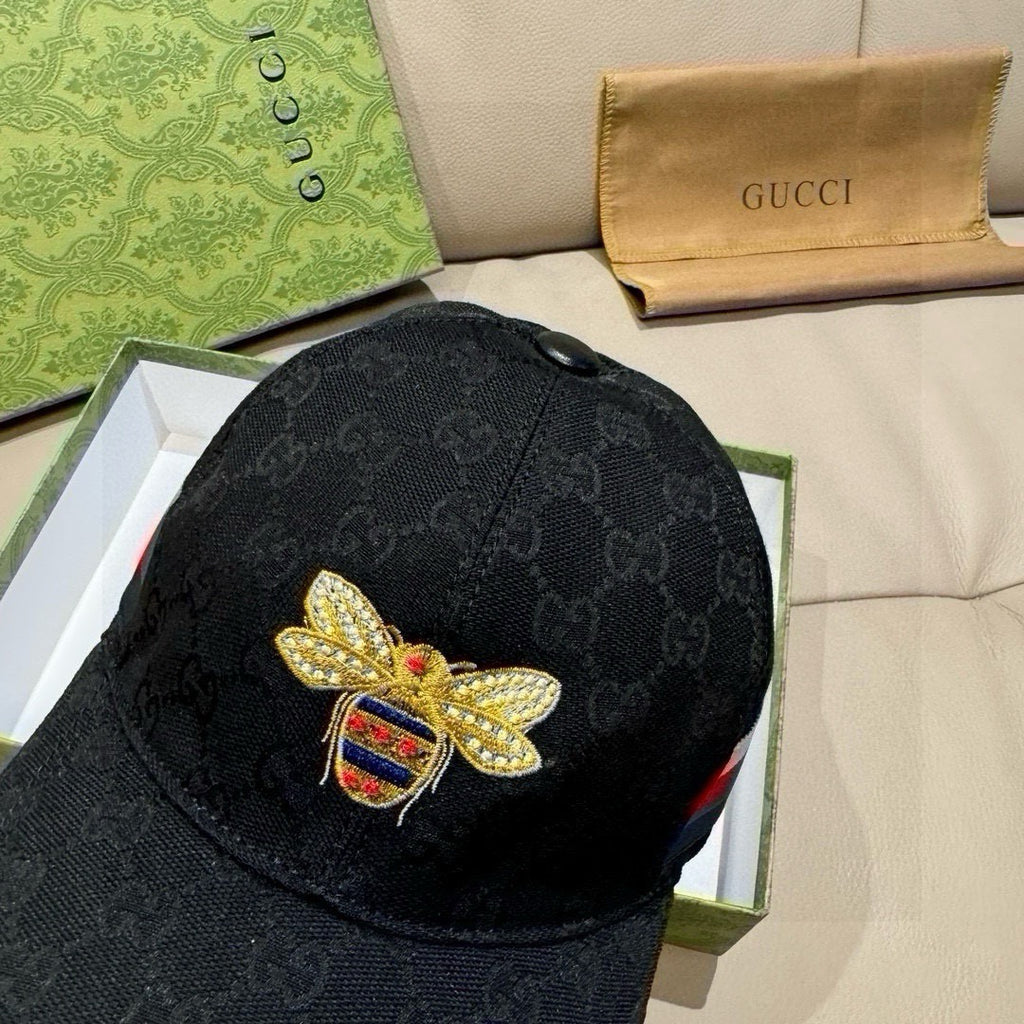 Black Gucci baseball cap with gold bee badge and multicolor crest