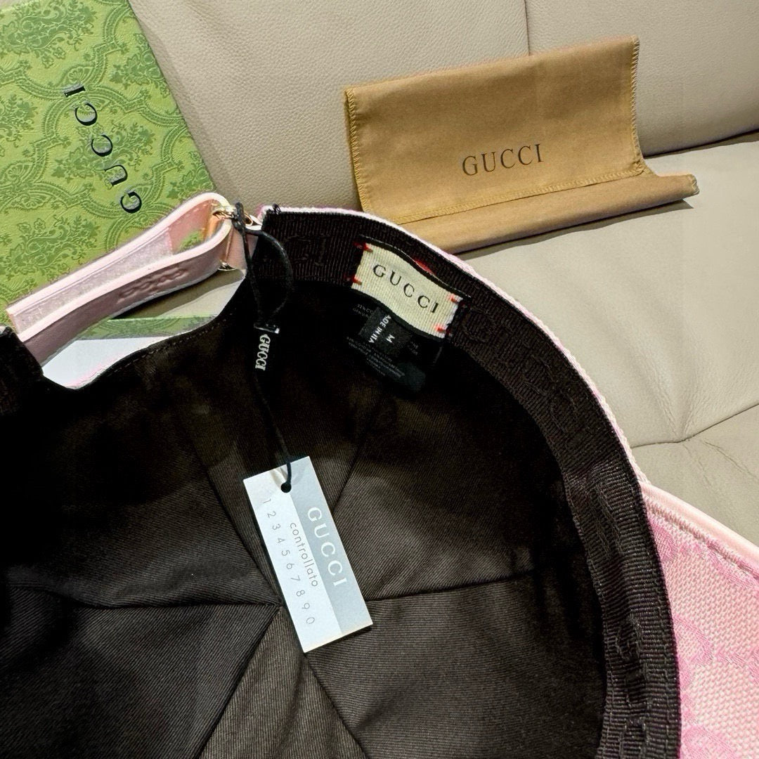 Inside view of pink baseball cap showing black band and Gucci-branded label