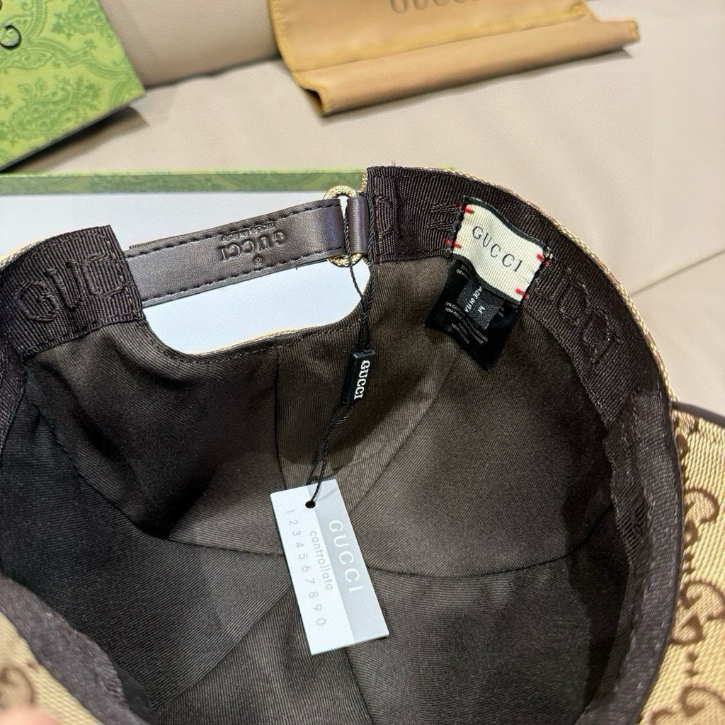 Black interior baseball cap with adjustable strap and GUCCI label