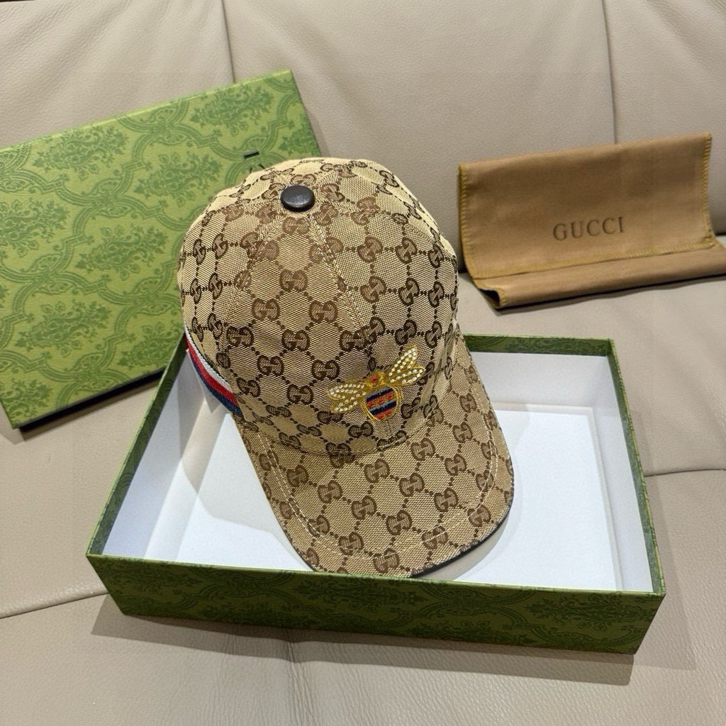 Tan GG monogram baseball cap with black top button and embroidered bee
