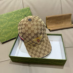 Tan GG monogram baseball cap with black top button and embroidered bee