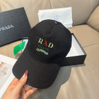 Prada baseball cap, black with front Prada Milano logo patch.
