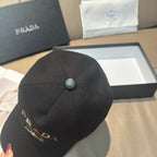 Prada baseball cap, black back view with center button and curved seams.