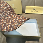 Burberry baseball cap with TB monogram print, close-up of brim and crown