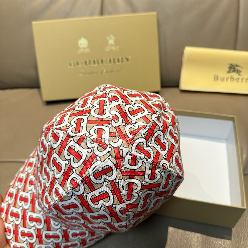 Baseball cap with red and white TB monogram pattern, close-up side detail.