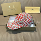 Baseball cap with red and white TB monogram pattern, curved brim.