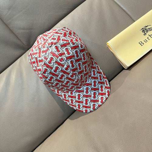 Baseball cap with red, white, and dark TB monogram print, side view.