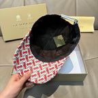 Baseball cap with patterned exterior and black inner lining, tag inside.