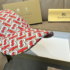 Baseball cap with red and white TB monogram pattern, brim and side seam.