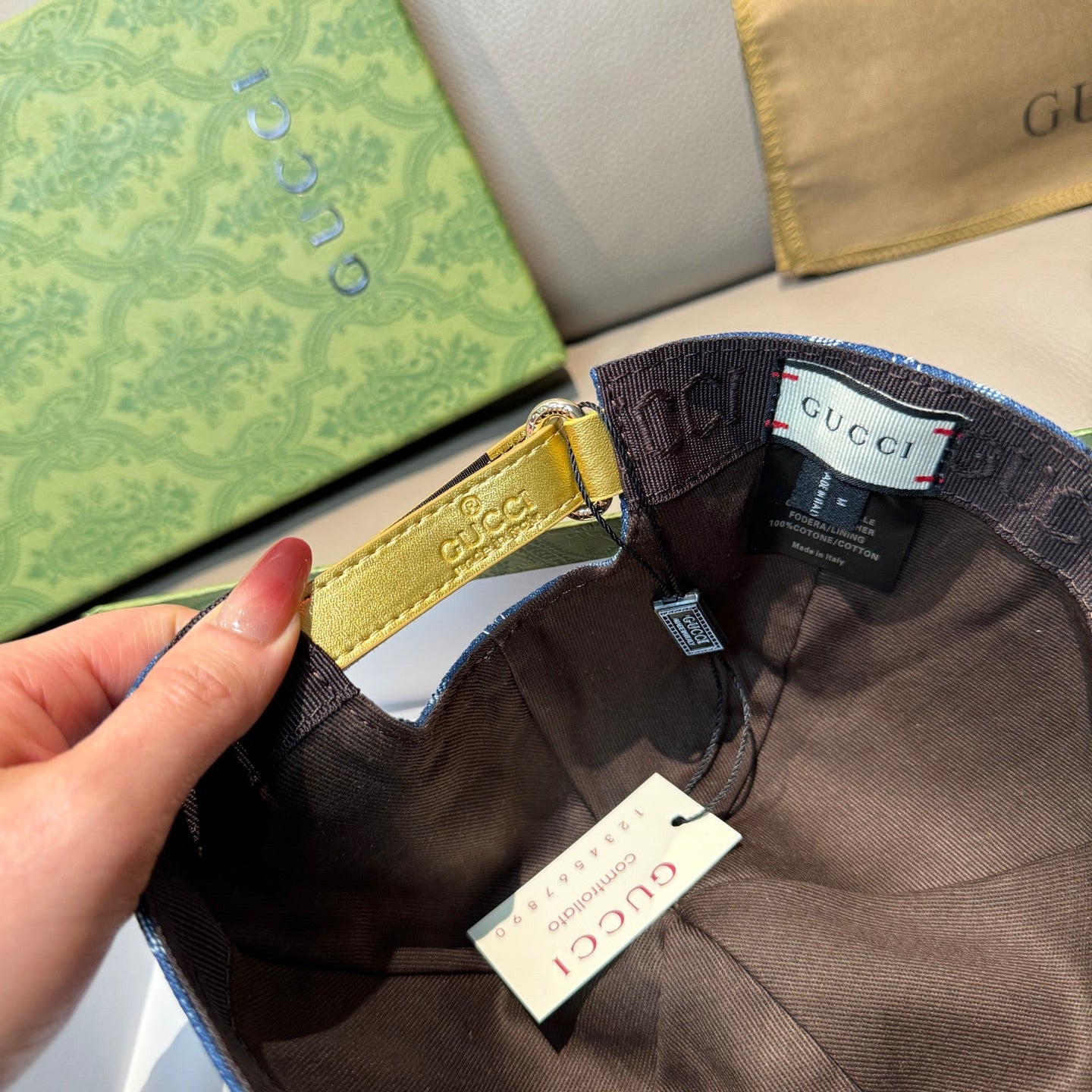 Gucci cap interior with adjustable strap and dark lining, blue GG denim exterior