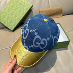 Gucci blue GG denim baseball cap with gold button and contrast yellow visor