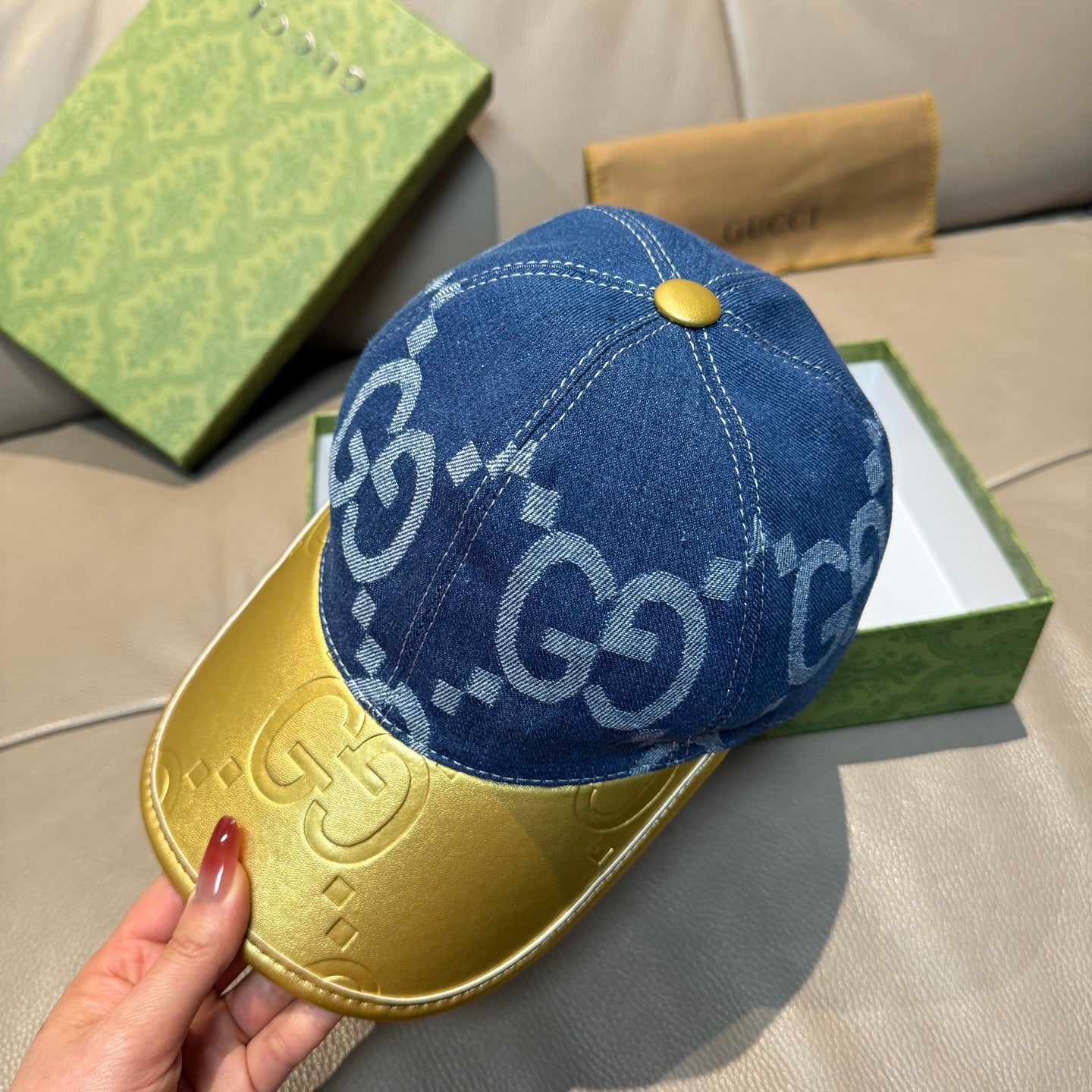 Gucci blue GG denim baseball cap with gold button and contrast yellow visor
