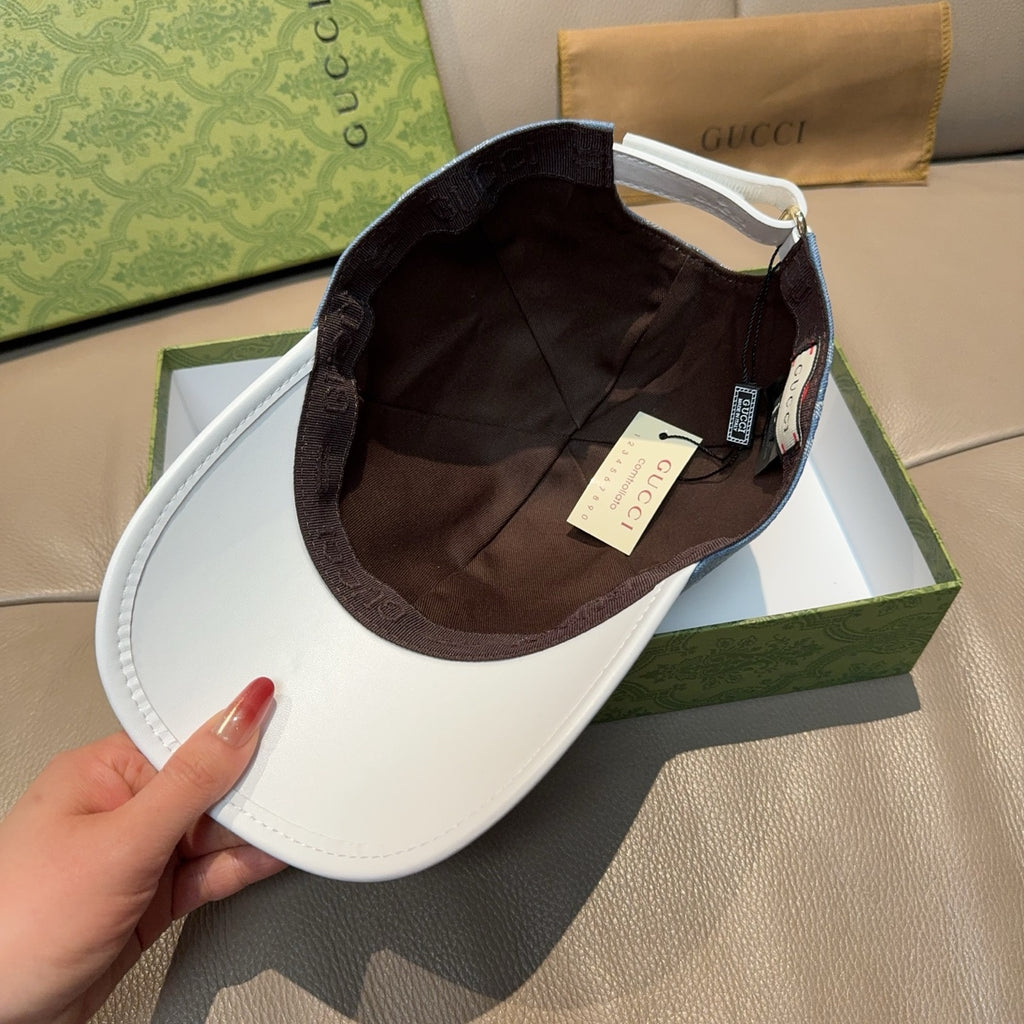 White Gucci cap with dark interior lining and brown underside