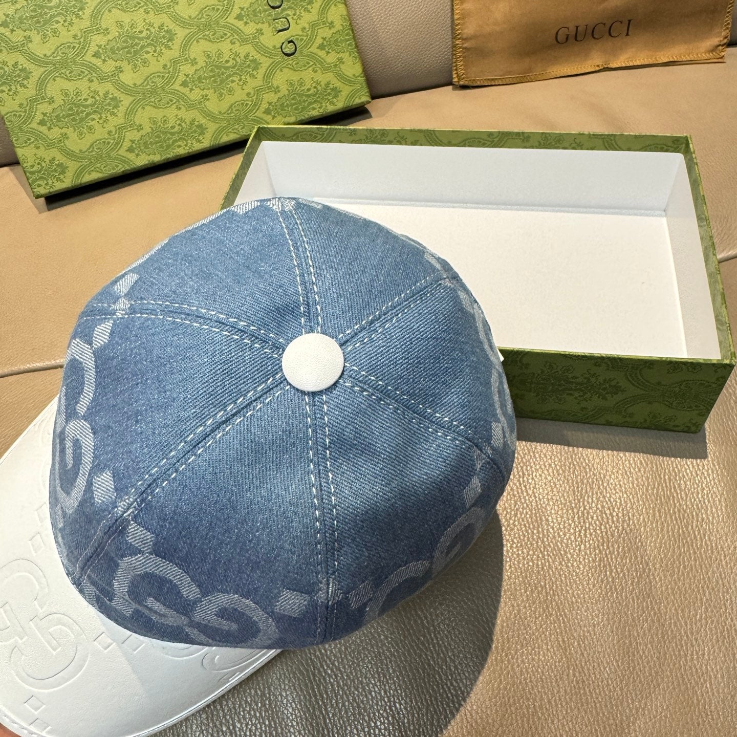Denim blue Gucci cap with GG jacquard pattern and round top button