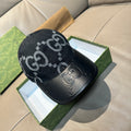 Gucci cap in dark denim with large GG monogram print and black leather brim