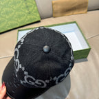 Dark GG monogram baseball cap with top button and black leather brim