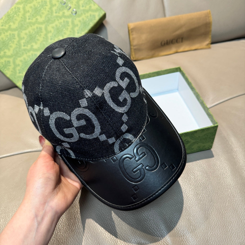 Dark GG monogram baseball cap viewed from side, with stud and black leather brim