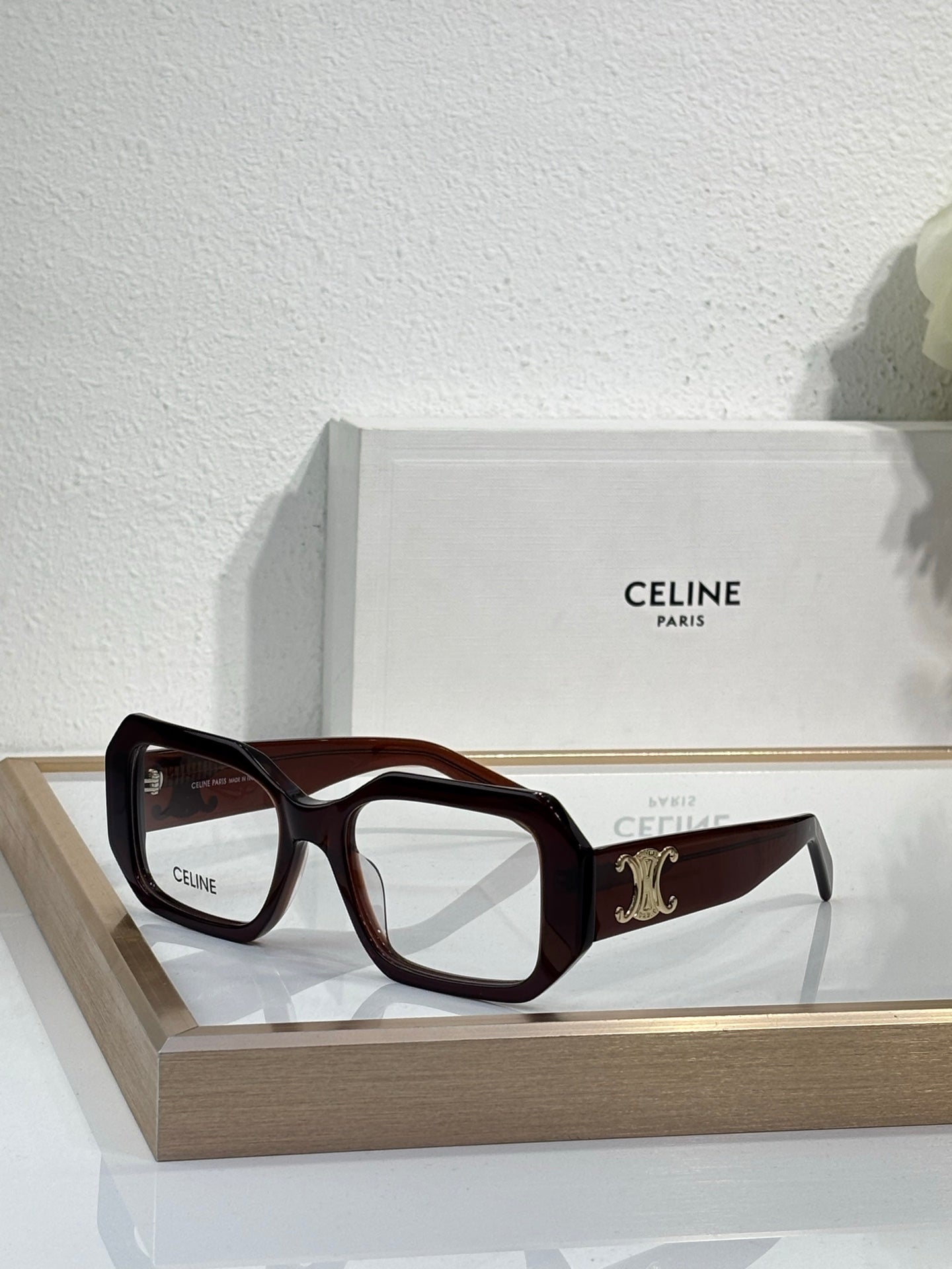 Celine glasses, dark brown square frames with gold logo and temple branding