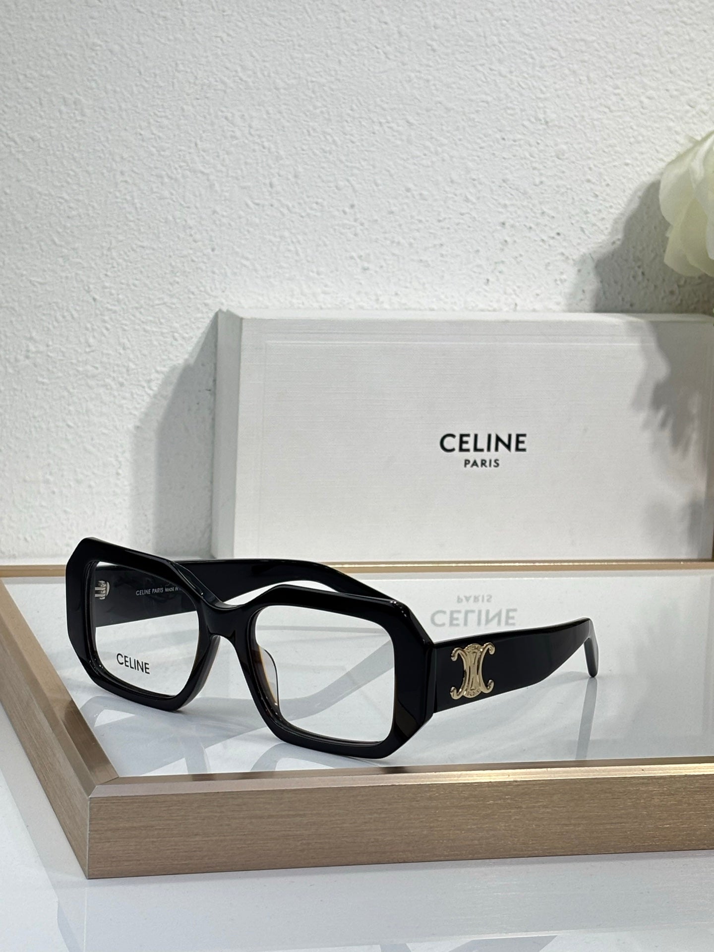Celine glasses, black square frames with gold logo detail on the temple