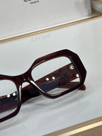 Celine glasses close-up, dark maroon square frame with logo near temple