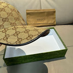 Tan GG canvas baseball cap with curved brim and multicolor web stripe detail.
