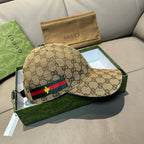Tan GG canvas baseball cap featuring multicolor web stripe and gold bee detail.