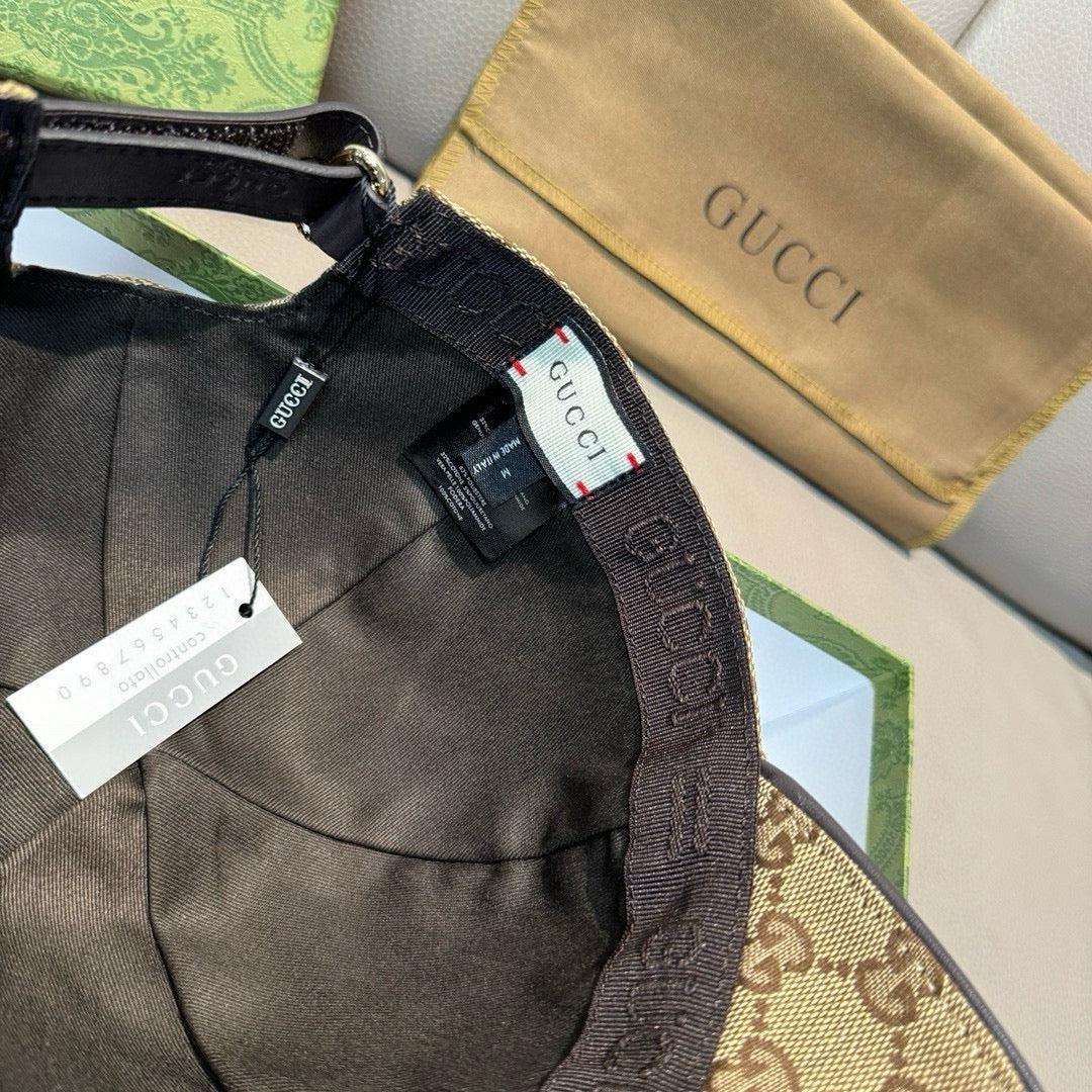 Baseball cap interior with black lining and adjustable strap, with Gucci-branded trim.