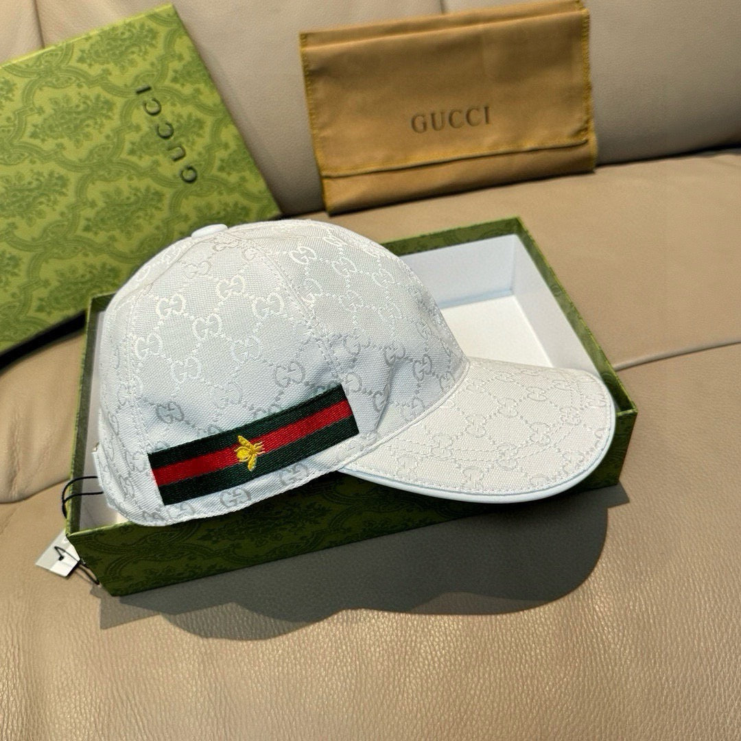 White GG-print baseball cap with green-red web stripe and gold star patch