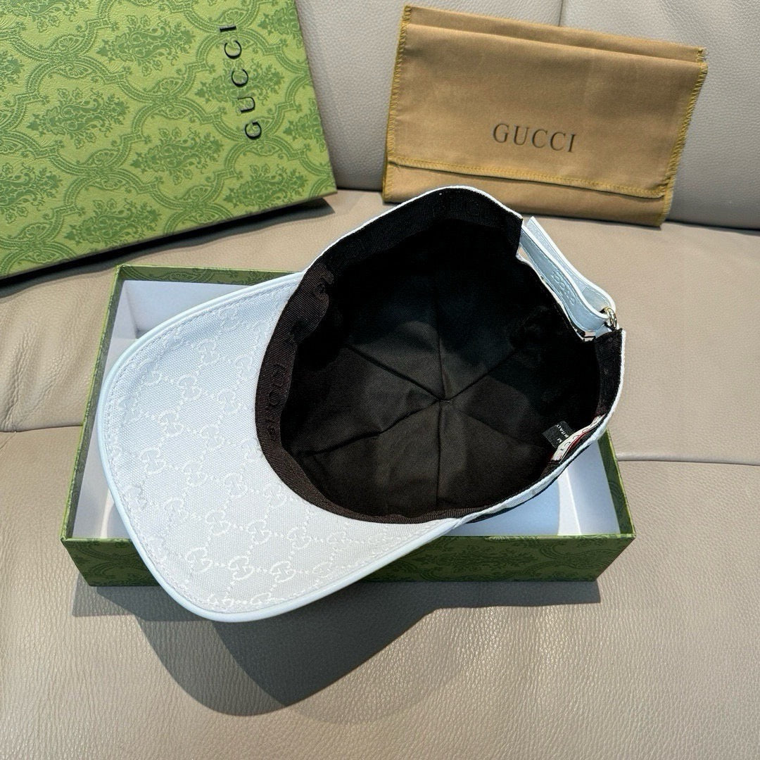 White GG-print baseball cap with black inner lining visible