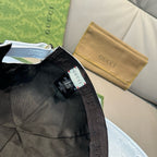 Black baseball cap interior with Gucci tag and adjustable web strap