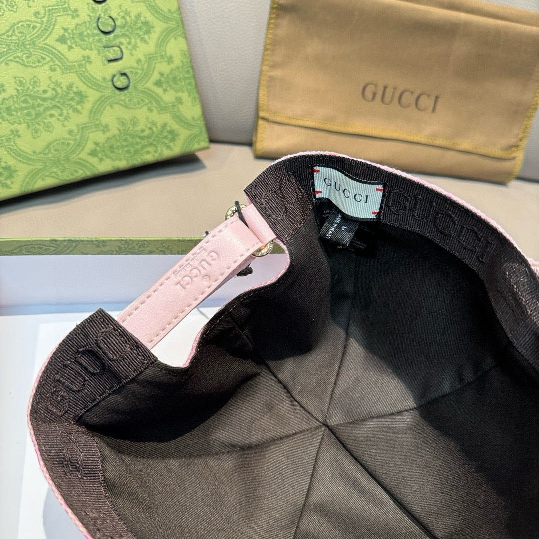 Cap interior with pink trim, adjustable strap, and Gucci label