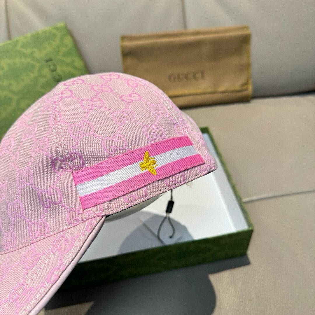 Pink monogram baseball cap close-up of stripe band with star emblem