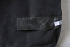 Balenciaga hoodie side label patch on dark gray fabric with woven BALENCIAGA branding