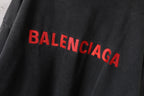 Balenciaga hoodie front detail in dark gray with large red BALENCIAGA lettering