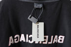 Balenciaga hoodie neckline close-up with inner label tag on dark gray knit fabric