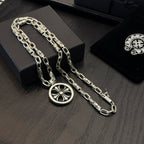 Chrome chain necklace with round pendant and blue cross detail