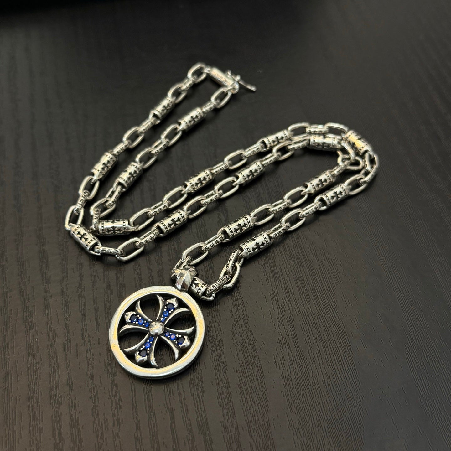 Chrome chain necklace pair with round blue cross medallion pendant