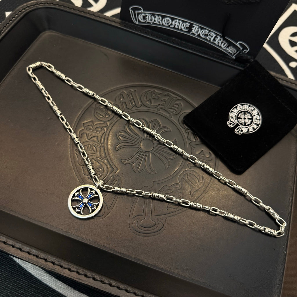 Chrome chain necklace with round blue cross pendant in a gift set tray