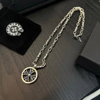Chrome chain necklace with round medallion pendant featuring blue cross details