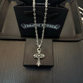 Chrome pendant necklace with star-and-cross charm and long linked chain