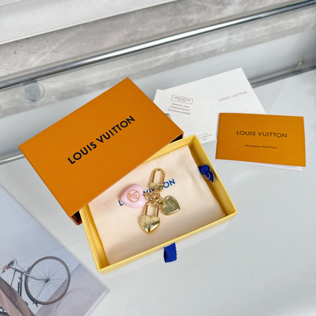 Heart keychain charm set in white pouch with Louis Vuitton box and papers