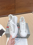 White lace-up sneaker with textured side panel and glossy trim