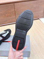 Prada unisex sneaker outsole, dark tread with red heel insert